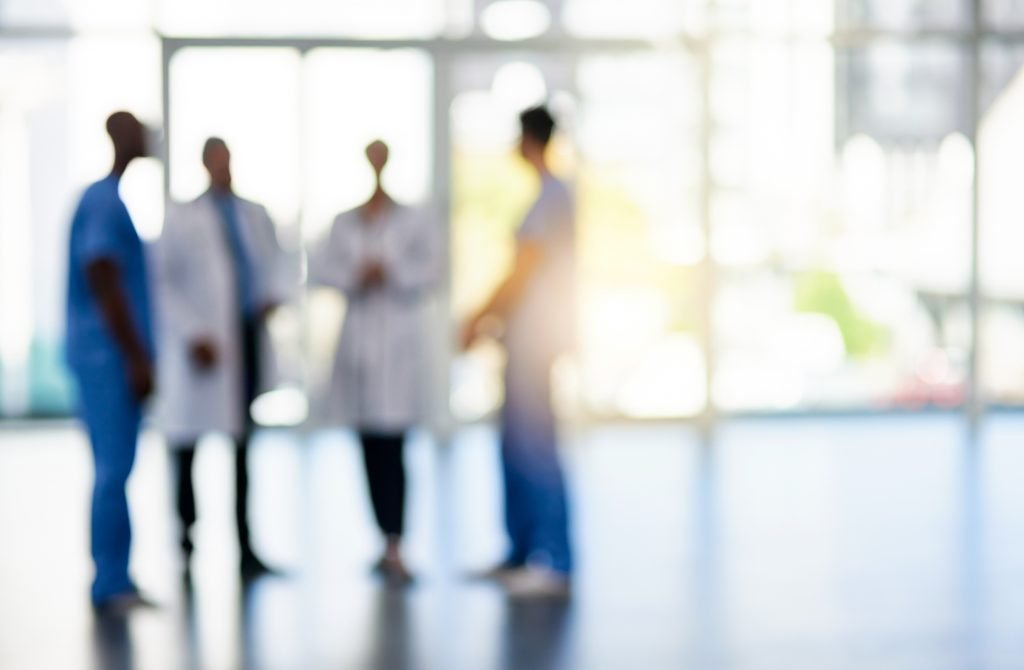 Group of Dentists conversing in an office