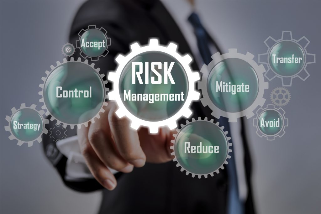 Business man selecting Risk management concept on scren