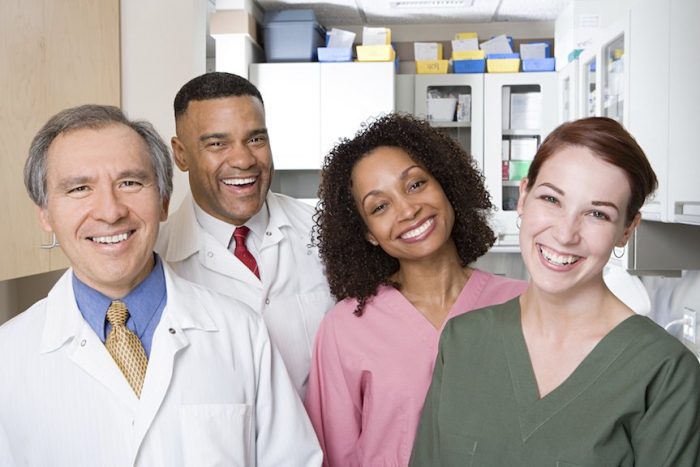 Dentists smiling in a dental office